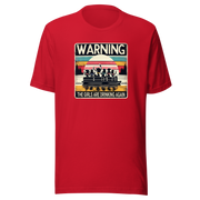 Tee showing "Warning: The Girls Are Drinking Again" with an image of girls on a pontoon boat enjoying drinks at sunset.