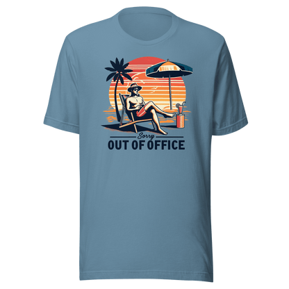 Man lounging in a beach chair with a cocktail, wearing our 'Sorry, Out of Office' vintage tee against a retro sunset backdrop.