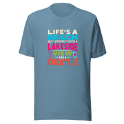 Tee displaying "Life's a Beach but I Prefer It with a Lakeside View and a Cocktail" in bright, eye-catching colors.