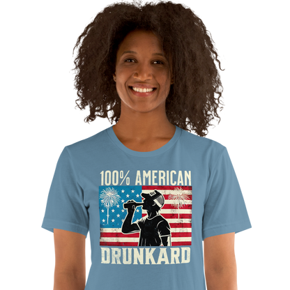 4th of July T-shirt with '100% American Drunkard' text, man drinking a bottle of beer wearing a trucker hat, and distressed American flag background