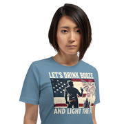 4th of July T-shirt with 'Let's Drink Booze and Light the Fuse' text, featuring a festive, patriotic theme