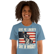 'Give Me Liberty or Give Me Whiskey' text, Statue of Liberty holding a shot glass, and distressed American flag background