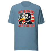 Get festive with our Day Drinking Like Abe Lincoln Tee! Perfect for 4th of July BBQs and showing off your patriotic spirit in style. Cozy & stylish.