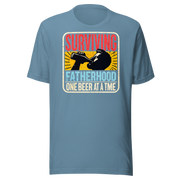 Celebrate fatherhood with our "Surviving Fatherhood One Beer at a Time" t-shirt. Perfect gift for dads who love a cold one. Ideal for Father's Day or birthdays.