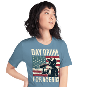 T-shirt with Day Drunk for America text, silhouette of a man drinking a bottle of beer, and distressed American flag background. Perfect for 4th of July.