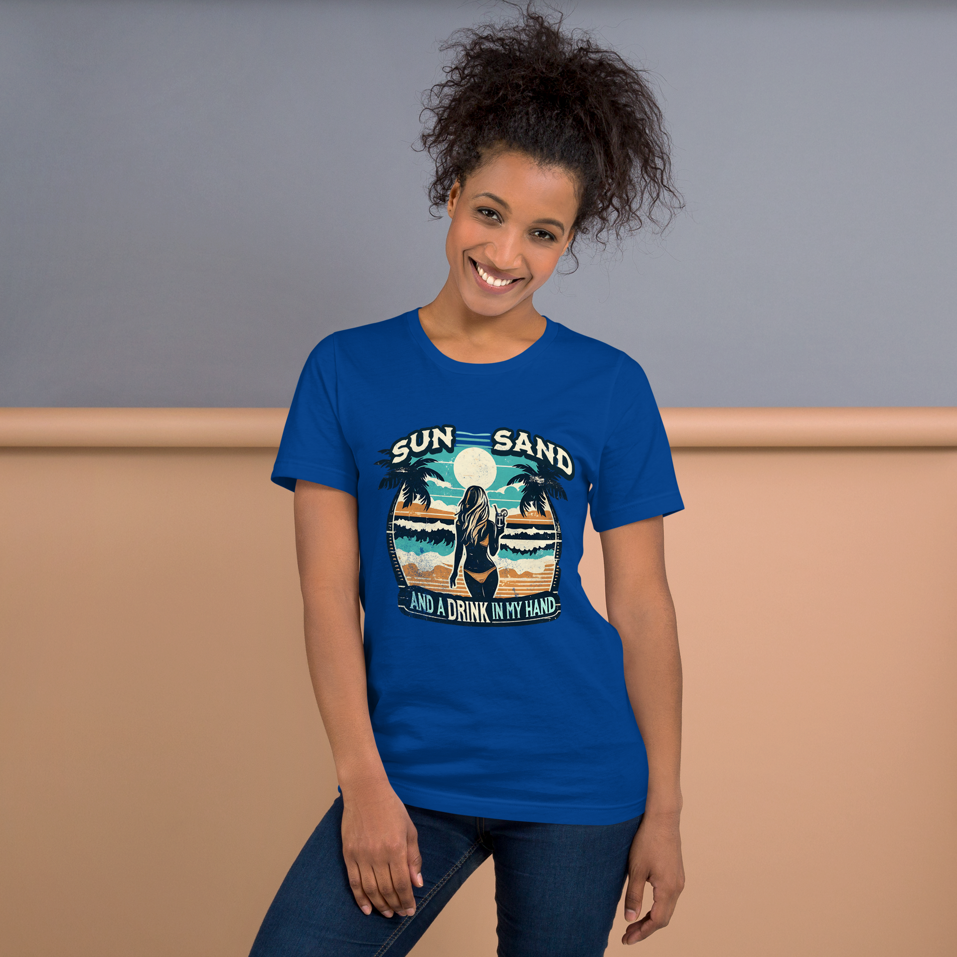 Woman with cocktail on beach on 'Sun, Sand, and a Drink in My Hand' tee, showcasing ocean and sun background