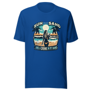 Woman with cocktail on beach on 'Sun, Sand, and a Drink in My Hand' tee, showcasing ocean and sun background