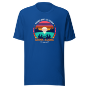 Tee showcasing "Friends Don't Let Friends Drink Alone at the Lake" with a retro sunset and lake scene.