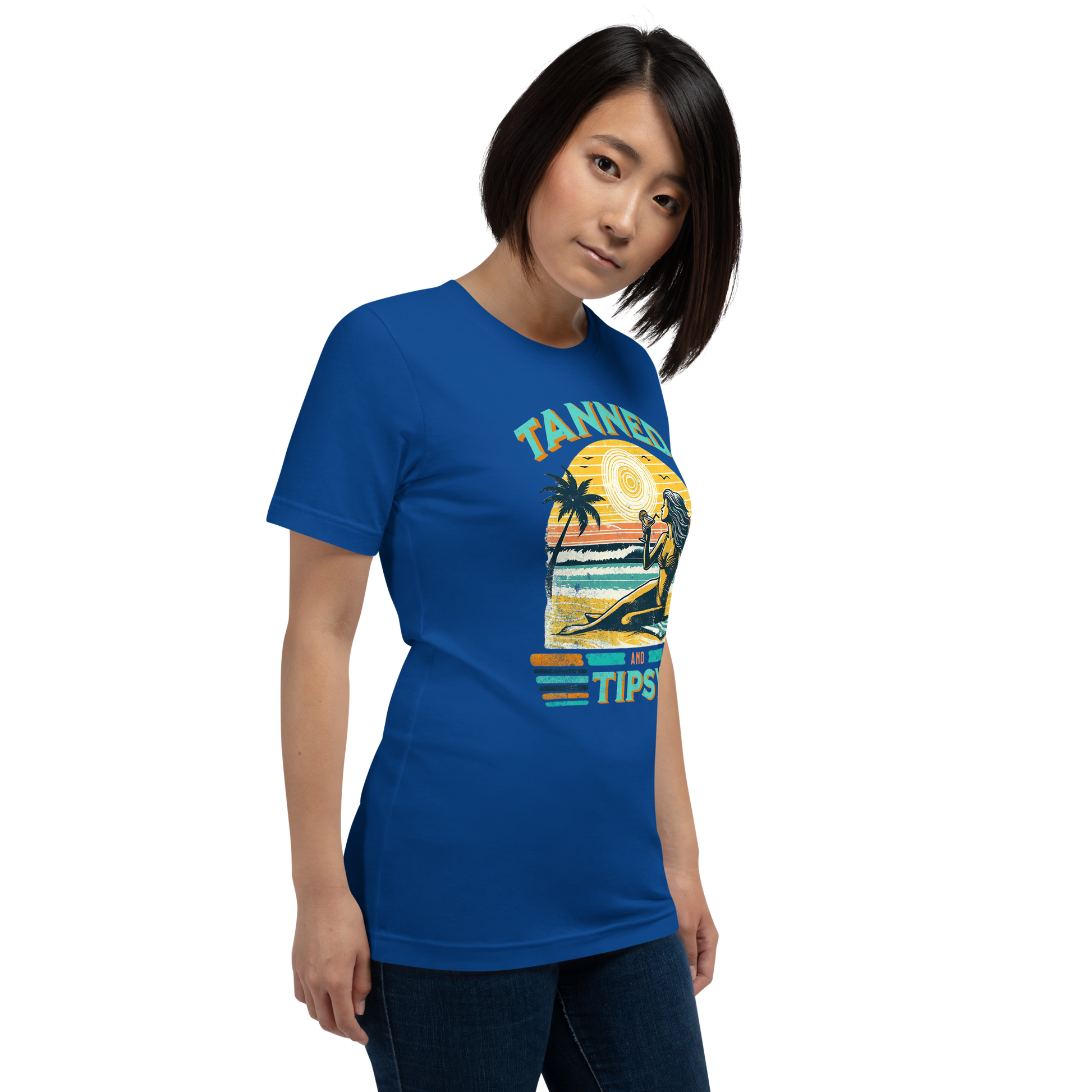 Vintage-inspired 'Tanned and Tipsy' tee with a woman sipping a cocktail on a beach at sunset, perfect for beach drinking and summer parties.