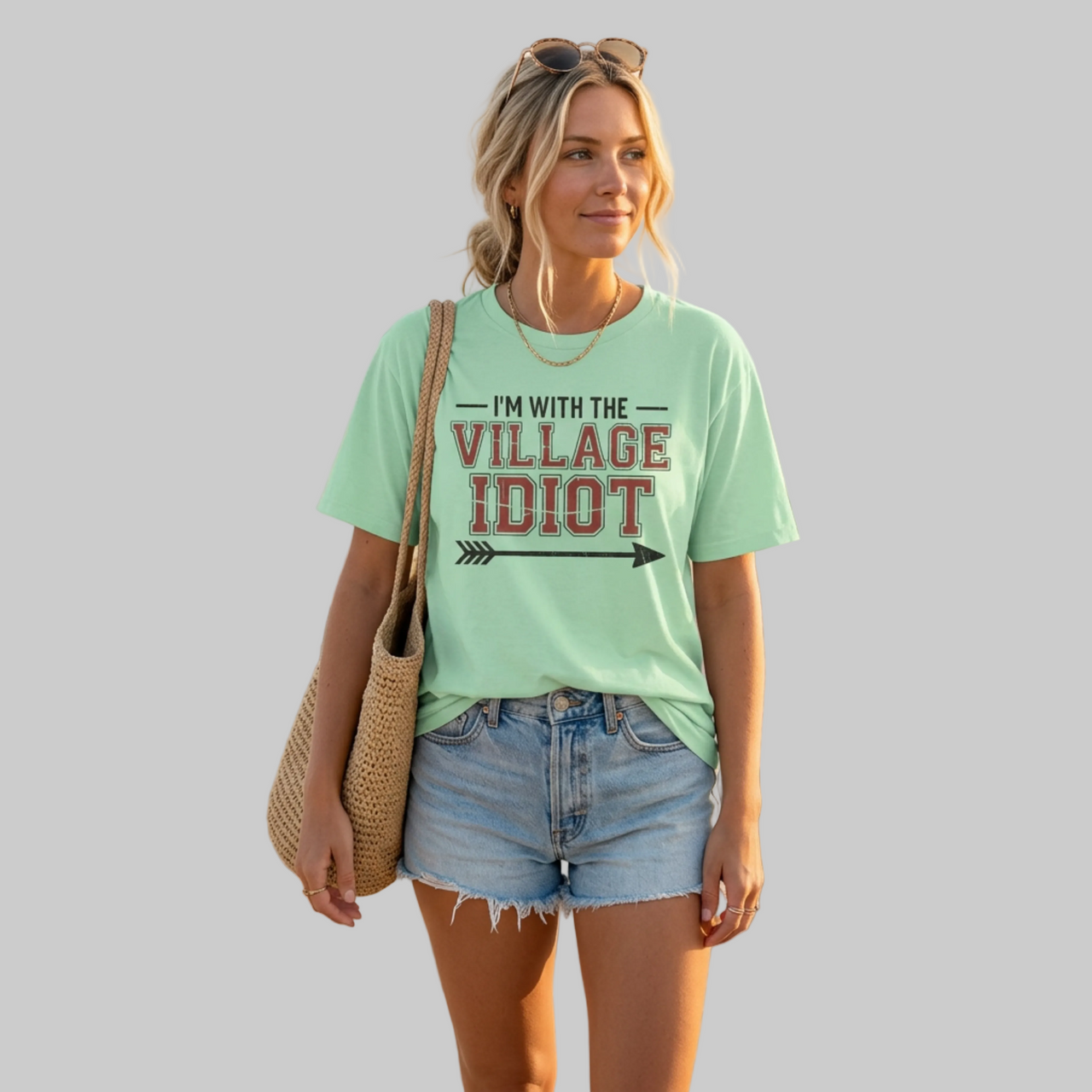 premium softstyle t-shirt  with the phrase  'I'm with the village idiot' funny spring break, beach vacations, lake days, girls trip, guys trip, matching couples designs