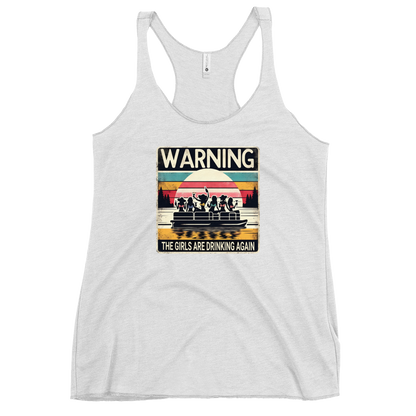 Racerback tank featuring "Warning: The Girls Are Drinking Again" with an illustration of girls drinking on a pontoon boat at sunset.