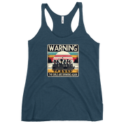 Racerback tank featuring "Warning: The Girls Are Drinking Again" with an illustration of girls drinking on a pontoon boat at sunset.