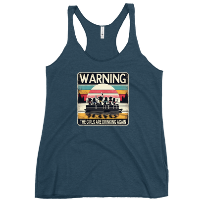 Racerback tank featuring "Warning: The Girls Are Drinking Again" with an illustration of girls drinking on a pontoon boat at sunset.