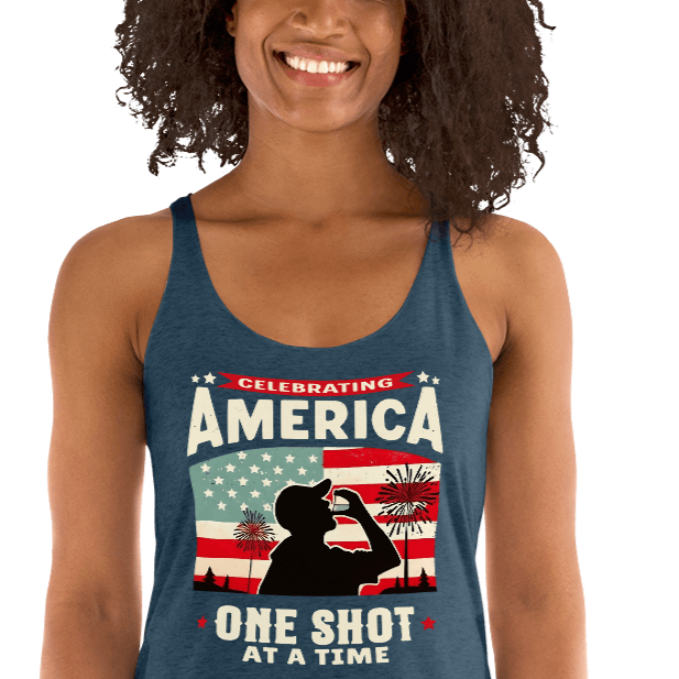 Racerback tank with Celebrating America One Shot at a Time text, silhouette of a man drinking a shot, and distressed American flag background. Perfect for 4th of July.