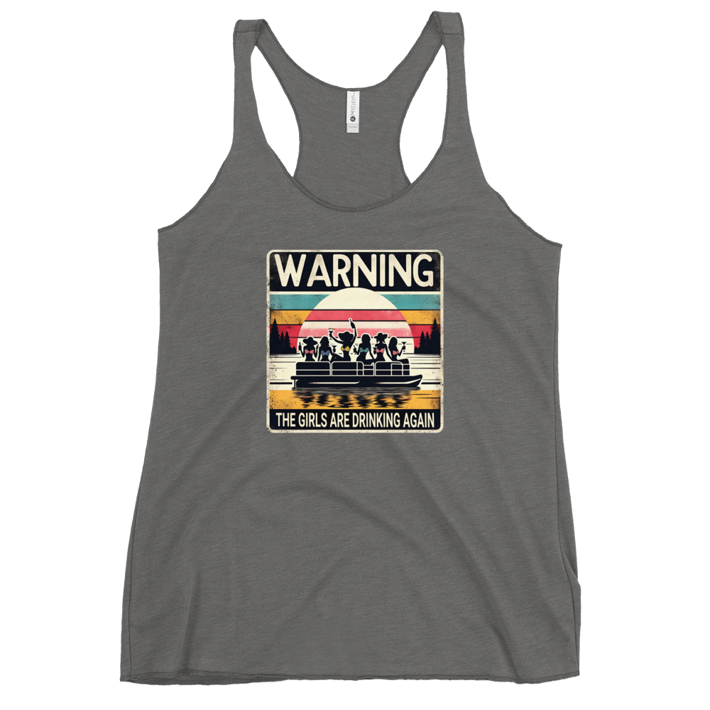 Racerback tank featuring "Warning: The Girls Are Drinking Again" with an illustration of girls drinking on a pontoon boat at sunset.