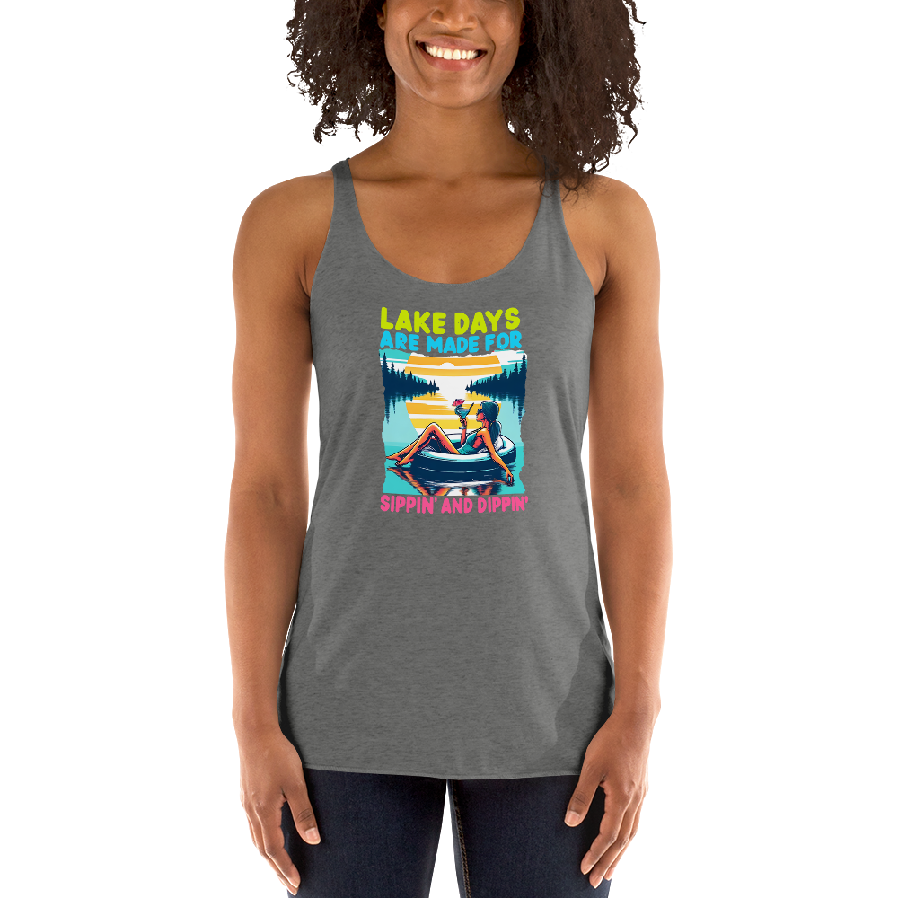 Racerback tank with "Lake Days Are Made for Sipping and Dipping," featuring a woman on a tube float with a cocktail, against a lake and sunset.