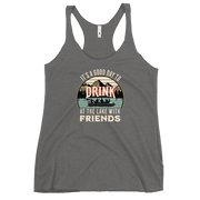 Racerback tank featuring "It's a Good Day to Drink at the Lake with Friends," with people on a boat, lake, and mountains in the background.