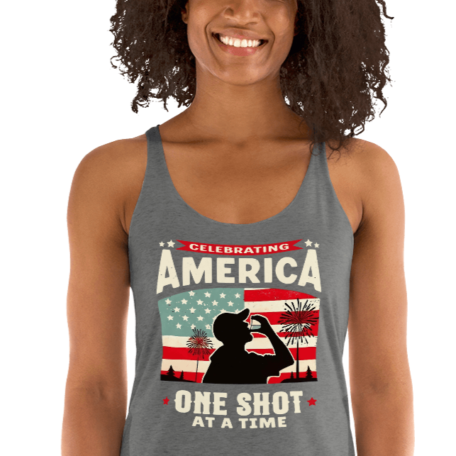 Racerback tank with Celebrating America One Shot at a Time text, silhouette of a man drinking a shot, and distressed American flag background. Perfect for 4th of July.