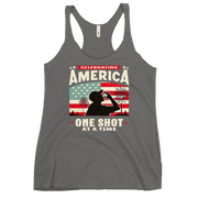 Racerback tank with Celebrating America One Shot at a Time text, silhouette of a man drinking a shot, and distressed American flag background. Perfect for 4th of July.