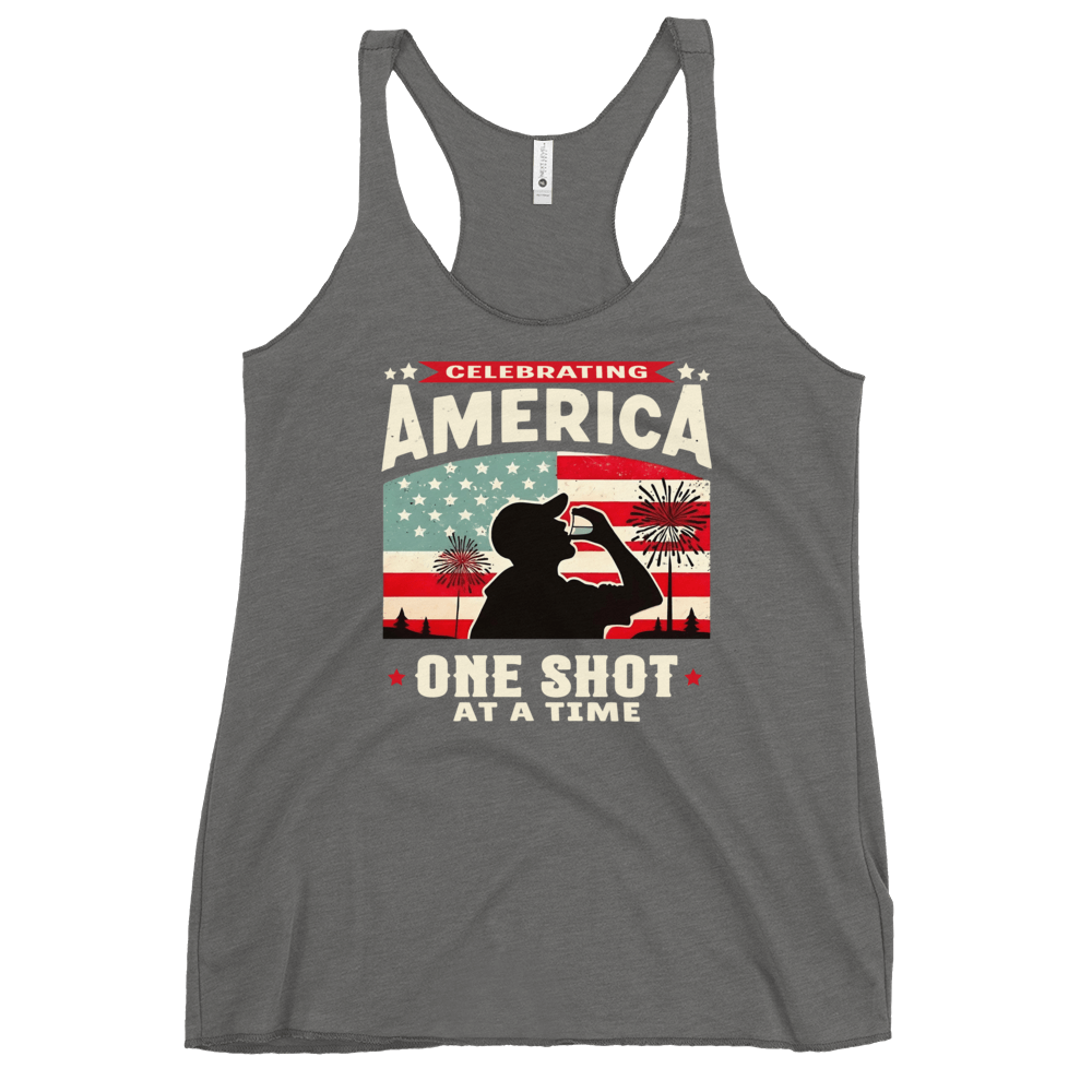 Racerback tank with Celebrating America One Shot at a Time text, silhouette of a man drinking a shot, and distressed American flag background. Perfect for 4th of July.