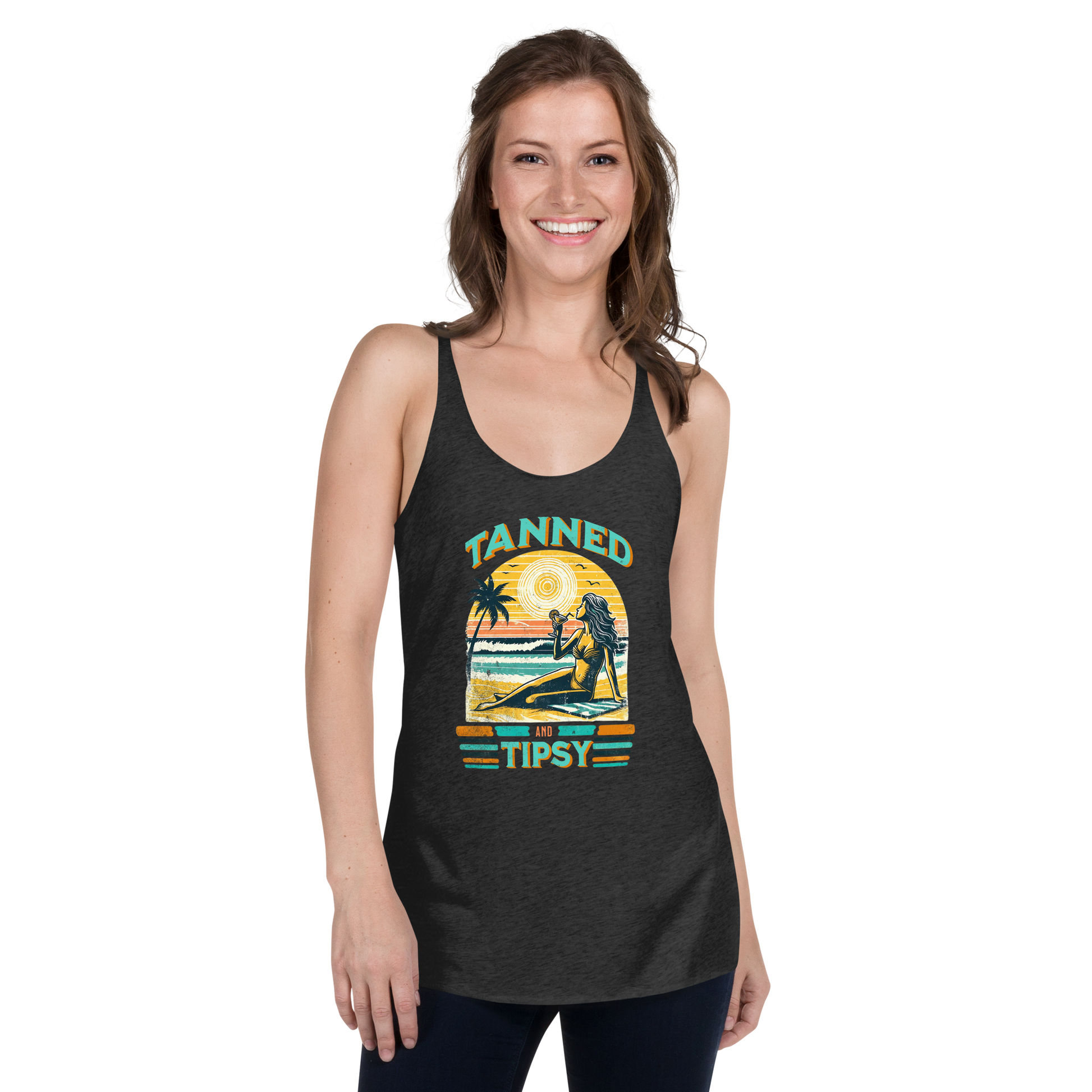 Retro 'Tanned and Tipsy' racerback tank with a woman enjoying a sunset cocktail on the beach, ideal for summer beach parties and day drinking.