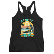 Retro 'Tanned and Tipsy' racerback tank with a woman enjoying a sunset cocktail on the beach, ideal for summer beach parties and day drinking.