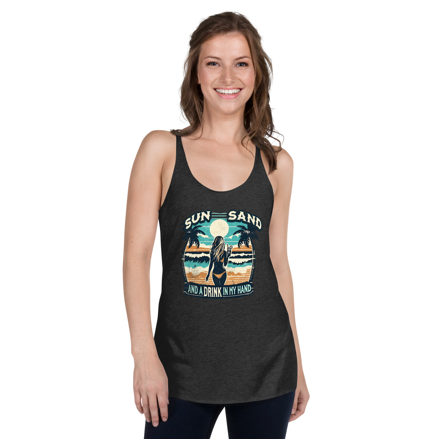 Beach scene on 'Sun, Sand, and a Drink in My Hand' racerback tank, with woman holding cocktail.