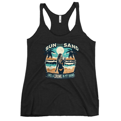 Beach scene on 'Sun, Sand, and a Drink in My Hand' racerback tank, with woman holding cocktail.