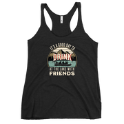 Racerback tank featuring "It's a Good Day to Drink at the Lake with Friends," with people on a boat, lake, and mountains in the background.