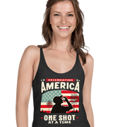 Racerback tank with Celebrating America One Shot at a Time text, silhouette of a man drinking a shot, and distressed American flag background. Perfect for 4th of July.