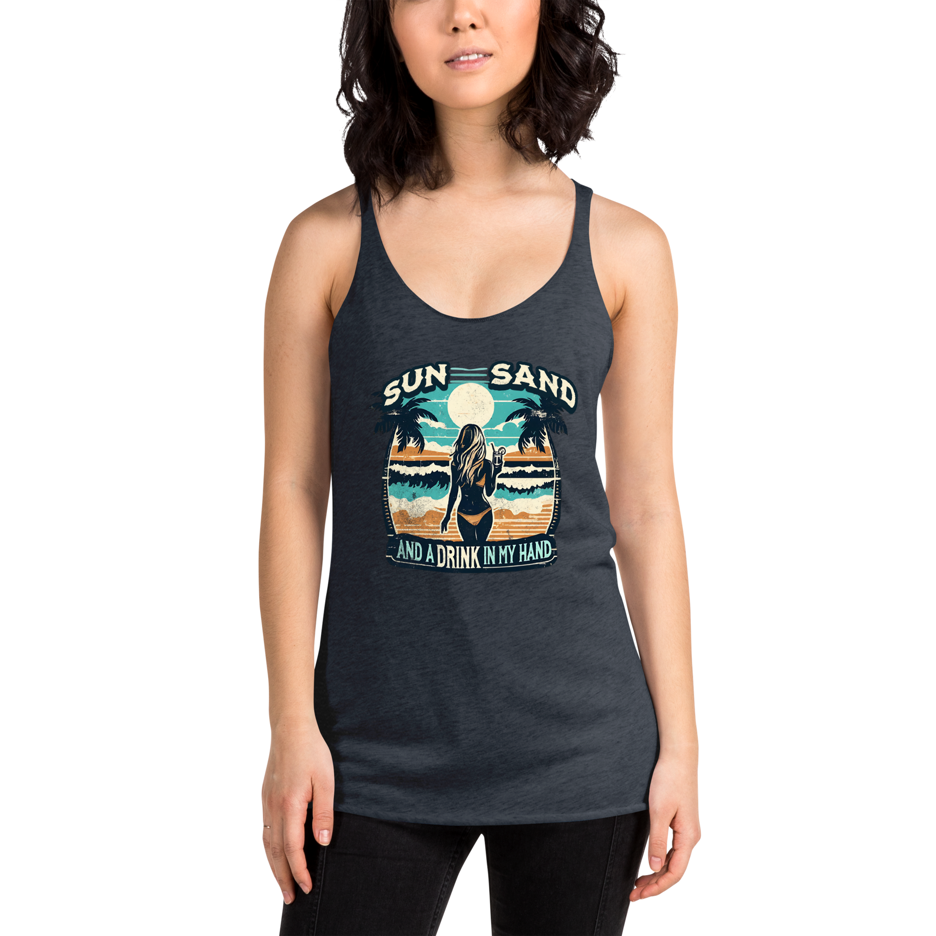 Beach scene on 'Sun, Sand, and a Drink in My Hand' racerback tank, with woman holding cocktail.