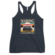 Racerback tank featuring "Warning: The Girls Are Drinking Again" with an illustration of girls drinking on a pontoon boat at sunset.