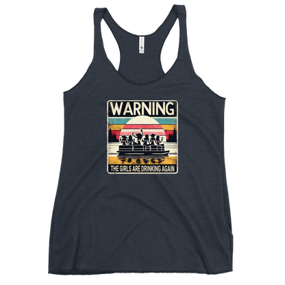 Racerback tank featuring "Warning: The Girls Are Drinking Again" with an illustration of girls drinking on a pontoon boat at sunset.