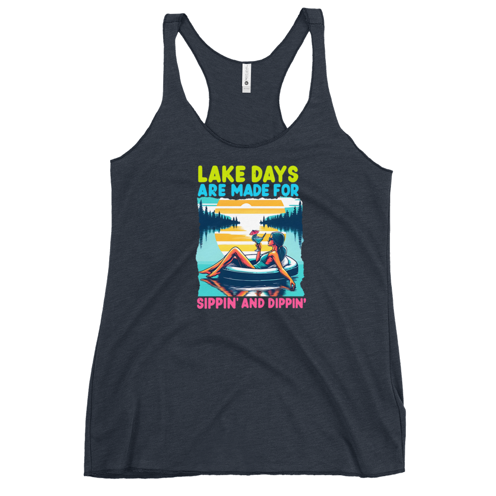 Racerback tank with "Lake Days Are Made for Sipping and Dipping," featuring a woman on a tube float with a cocktail, against a lake and sunset.