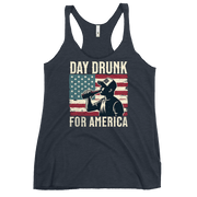 Racerback tank with Day Drunk for America text, silhouette of a man drinking a bottle of beer, and distressed American flag background. Perfect for 4th of July.