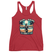 Beach scene on 'Sun, Sand, and a Drink in My Hand' racerback tank, with woman holding cocktail.