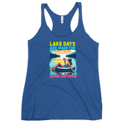 Racerback tank with "Lake Days Are Made for Sipping and Dipping," featuring a woman on a tube float with a cocktail, against a lake and sunset.