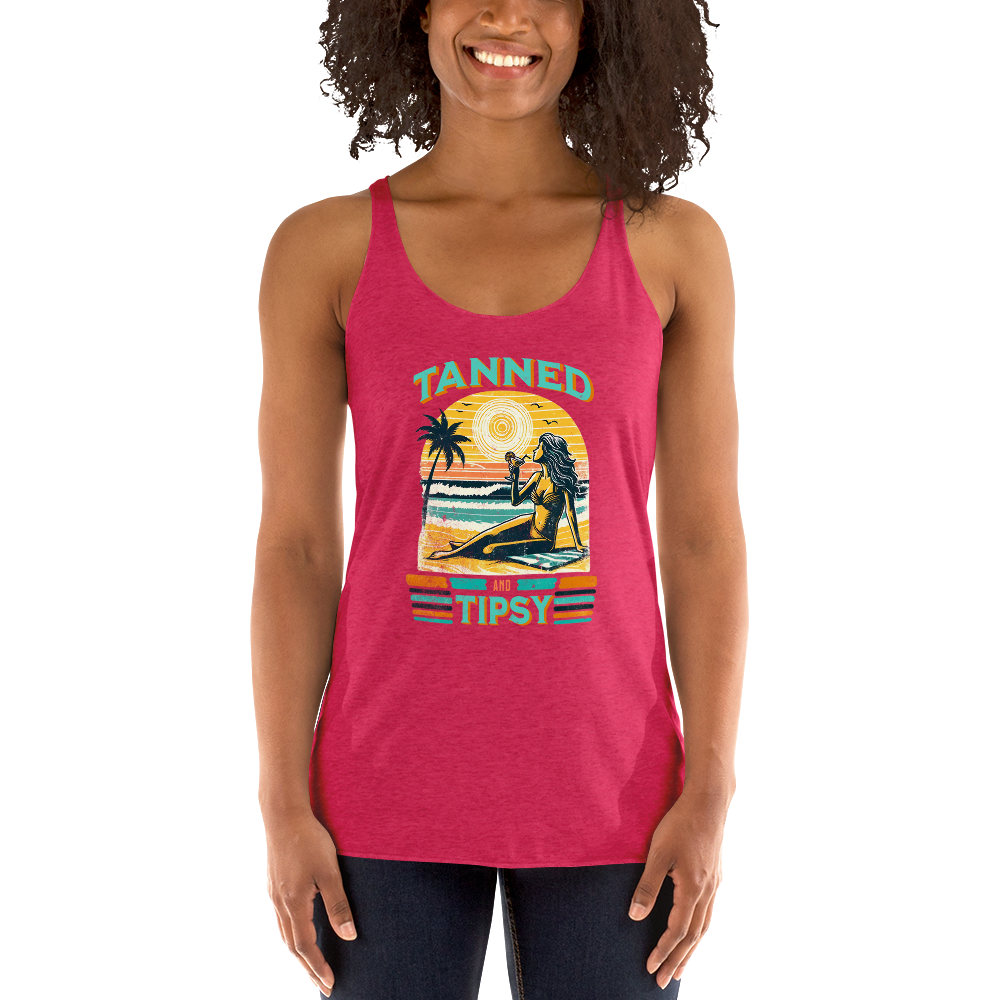 Retro 'Tanned and Tipsy' racerback tank with a woman enjoying a sunset cocktail on the beach, ideal for summer beach parties and day drinking.