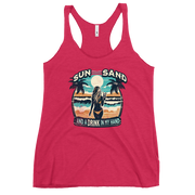 Beach scene on 'Sun, Sand, and a Drink in My Hand' racerback tank, with woman holding cocktail.