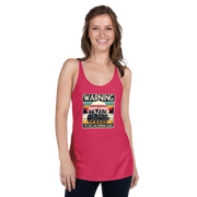 Racerback tank featuring "Warning: The Girls Are Drinking Again" with an illustration of girls drinking on a pontoon boat at sunset.