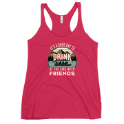 Racerback tank featuring "It's a Good Day to Drink at the Lake with Friends," with people on a boat, lake, and mountains in the background.