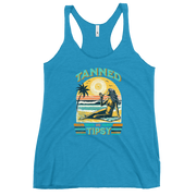 Retro 'Tanned and Tipsy' racerback tank with a woman enjoying a sunset cocktail on the beach, ideal for summer beach parties and day drinking.