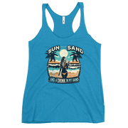 Beach scene on 'Sun, Sand, and a Drink in My Hand' racerback tank, with woman holding cocktail.