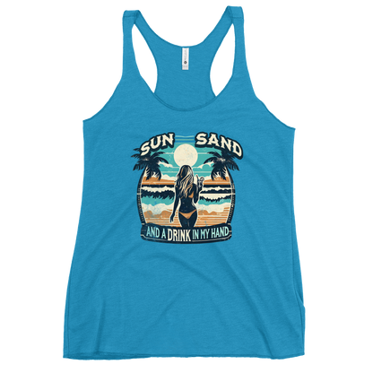 Beach scene on 'Sun, Sand, and a Drink in My Hand' racerback tank, with woman holding cocktail.