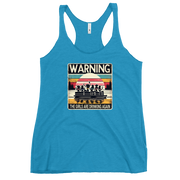 Racerback tank featuring "Warning: The Girls Are Drinking Again" with an illustration of girls drinking on a pontoon boat at sunset.