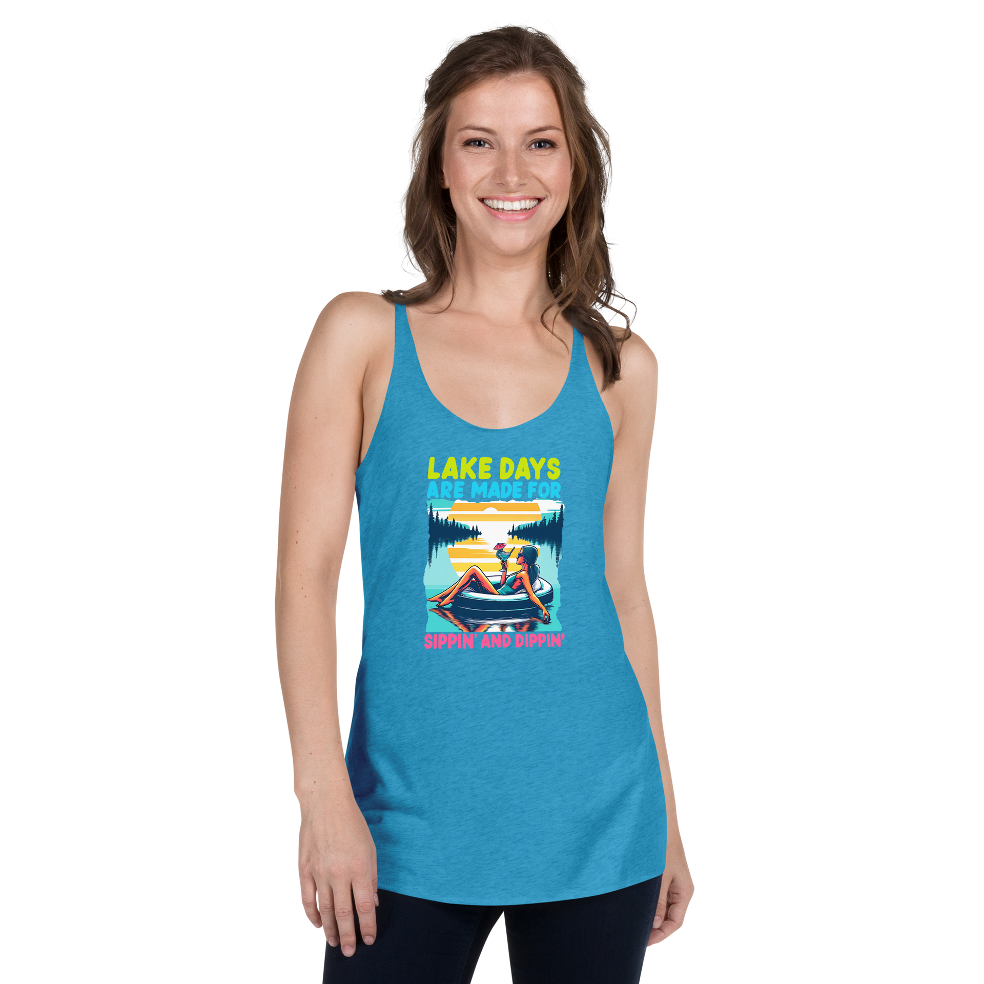 Racerback tank with "Lake Days Are Made for Sipping and Dipping," featuring a woman on a tube float with a cocktail, against a lake and sunset.