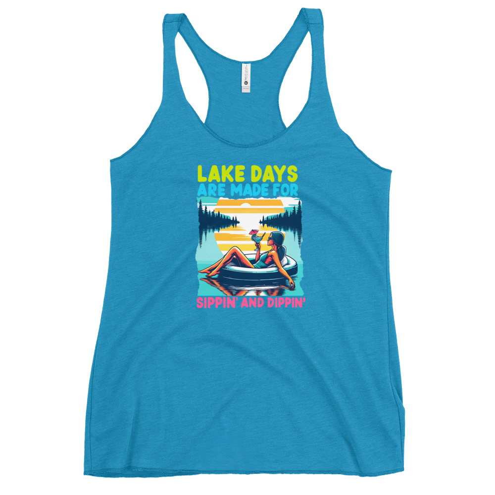 Racerback tank with "Lake Days Are Made for Sipping and Dipping," featuring a woman on a tube float with a cocktail, against a lake and sunset.