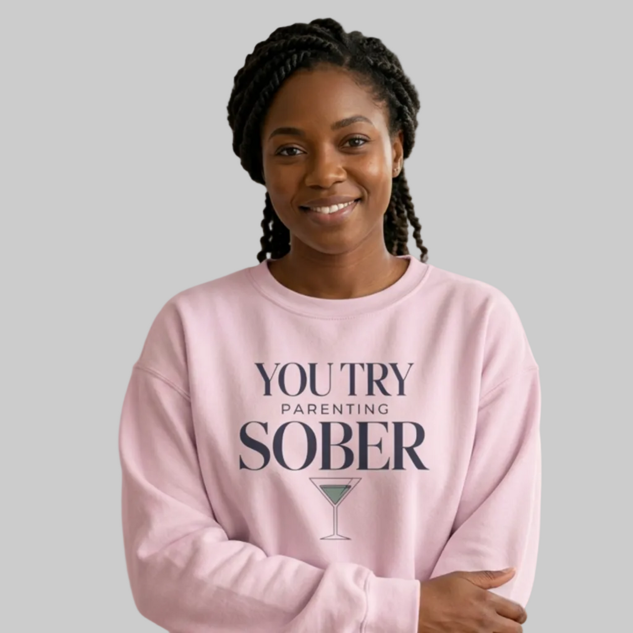 Woman wearing a pink sweatshirt with the text 'You try parenting sober' funny mother's day, mom life, girls trips, beach trip design